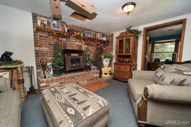 carpeted living room with brick wall and a textured ceiling