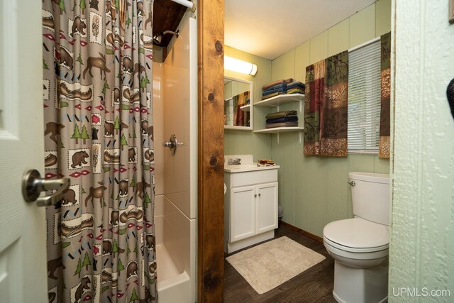 bathroom featuring hardwood / wood-style flooring, vanity, toilet, and a shower with shower curtain