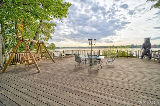 wooden deck with a water view