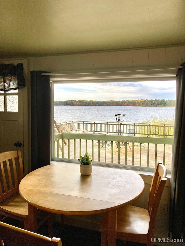 dining room featuring a water view