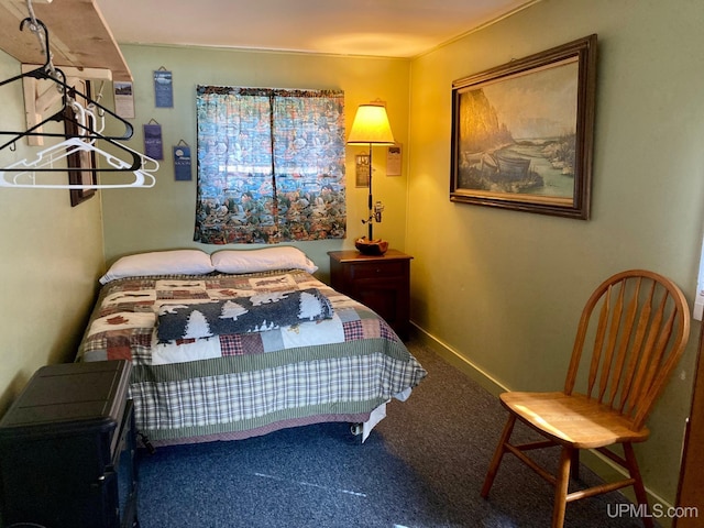 carpeted bedroom with baseboards