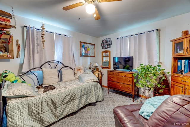 bedroom with light colored carpet and ceiling fan