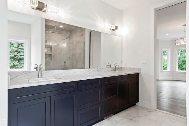 bathroom with vanity and a shower with shower door