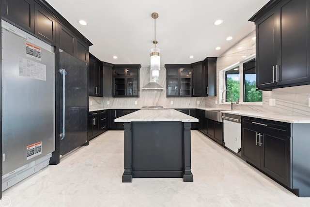 kitchen with wall chimney exhaust hood, sink, hanging light fixtures, appliances with stainless steel finishes, and a kitchen island