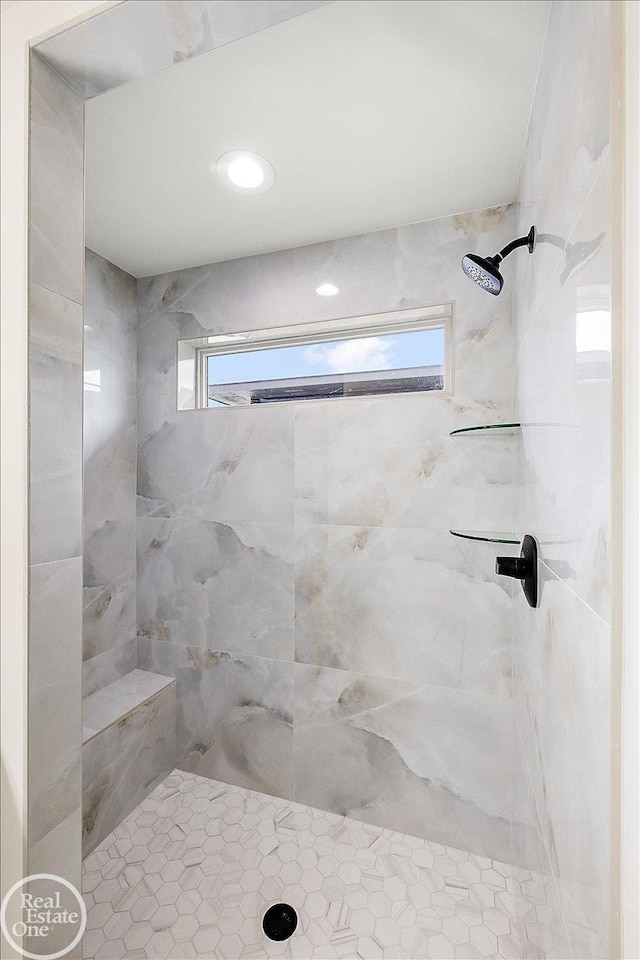 bathroom with tiled shower