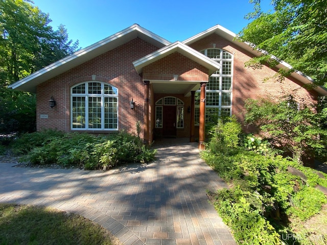 view of front of home with brick siding