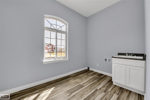 spare room with light hardwood / wood-style floors