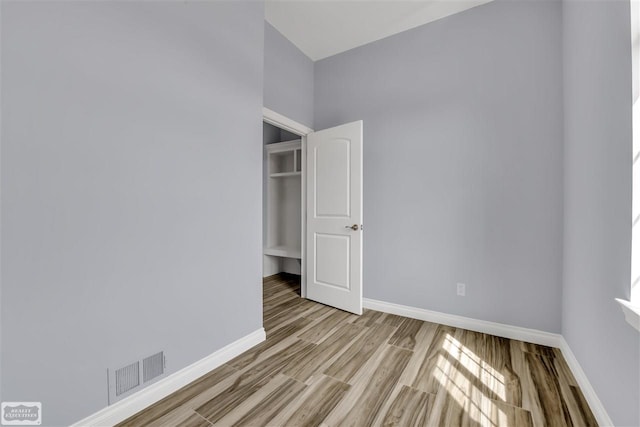 unfurnished room featuring light hardwood / wood-style flooring