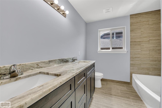 bathroom featuring toilet, tile flooring, and dual vanity