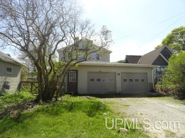 view of front of property featuring driveway and an attached garage