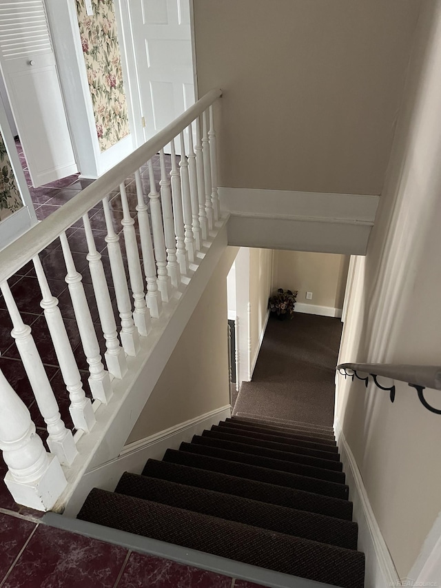 stairs with carpet flooring