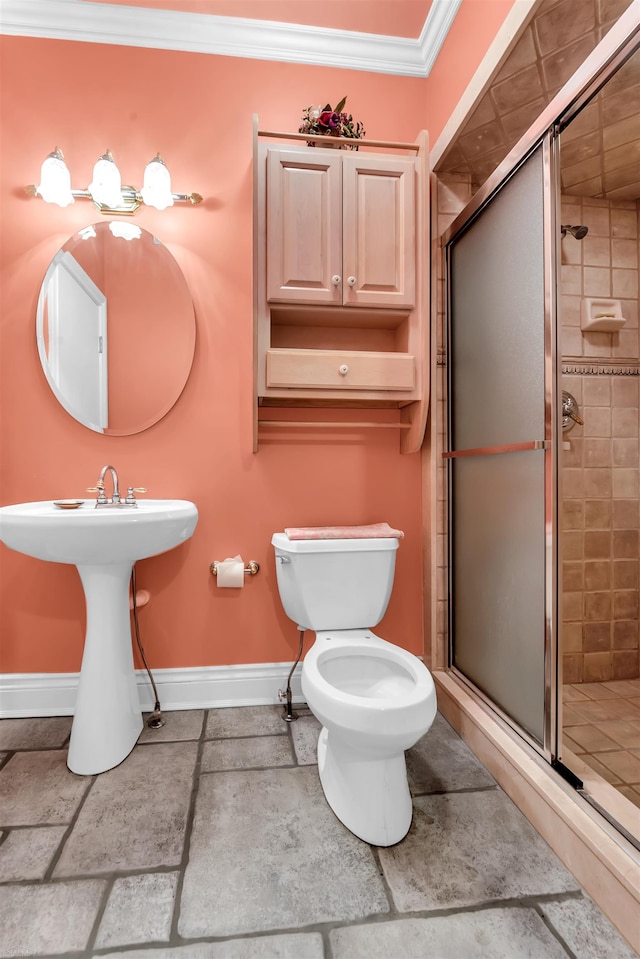 bathroom featuring tile flooring, ornamental molding, a shower with shower door, and toilet