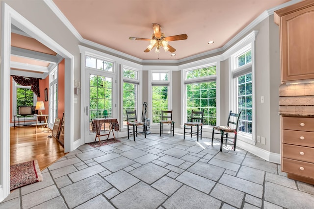 unfurnished room with ornamental molding, ceiling fan, and light tile floors