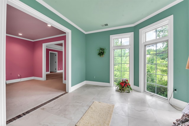 tiled spare room featuring ornamental molding