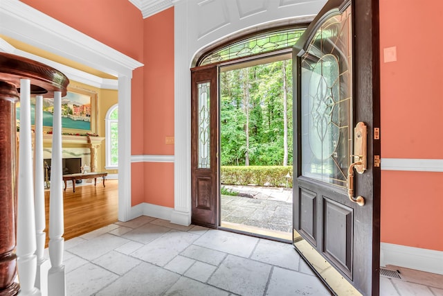 tiled foyer with crown molding