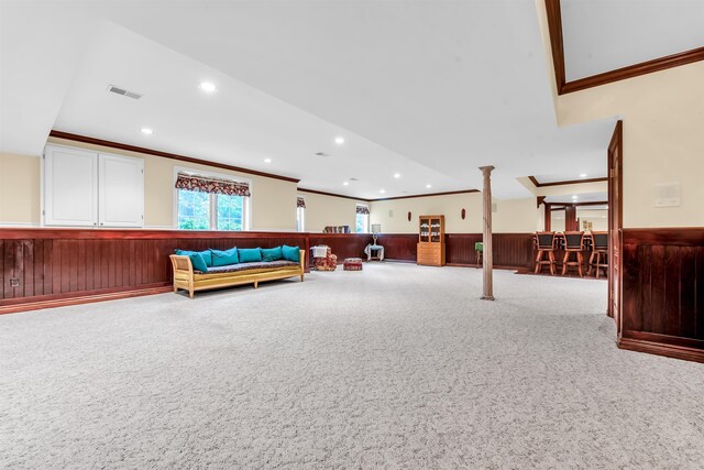 game room with carpet, bar area, decorative columns, and crown molding