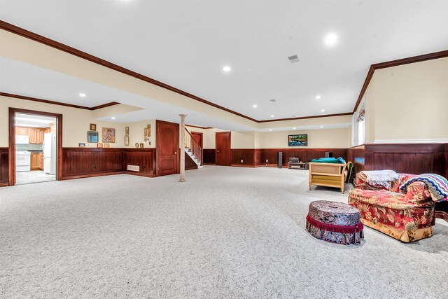 interior space featuring ornamental molding and light colored carpet