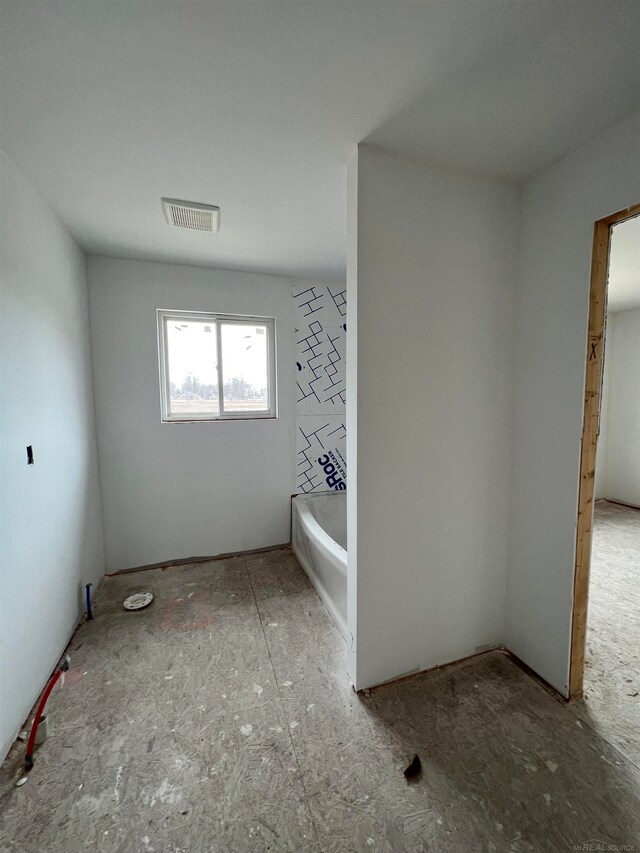 interior space featuring a bath to relax in