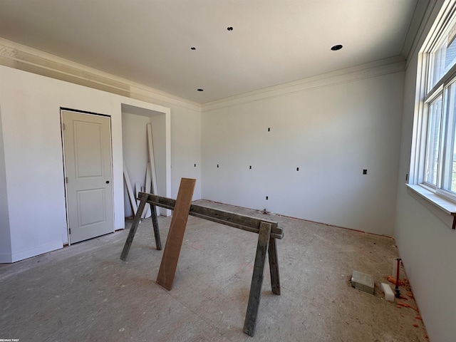 unfurnished bedroom with crown molding