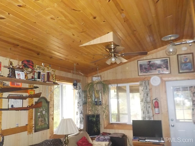 living room with vaulted ceiling, ceiling fan, and wood ceiling