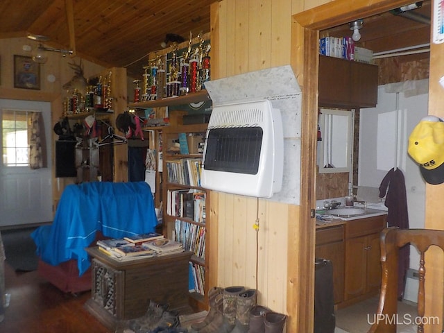 interior space featuring sink and lofted ceiling