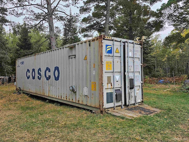 view of shed / structure with a yard