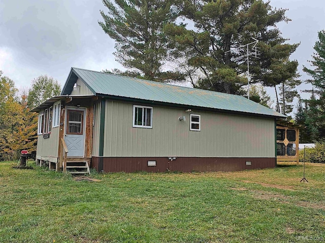 view of home's exterior featuring a yard