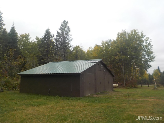 view of shed / structure with a yard