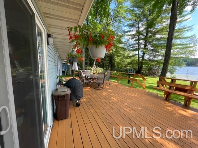 wooden terrace with a water view