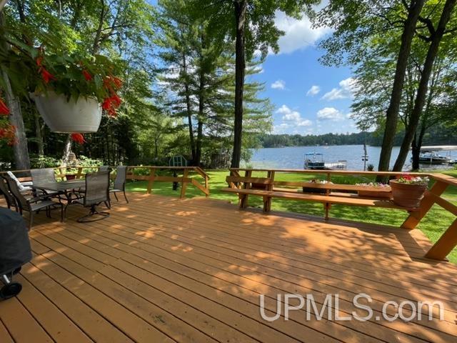 wooden terrace with a water view