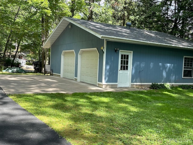 garage featuring a yard