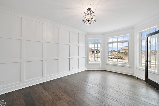 unfurnished sunroom featuring a chandelier