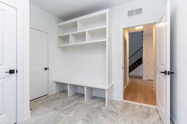 mudroom with visible vents and baseboards