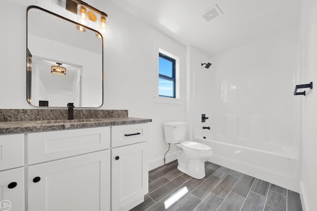 full bathroom featuring vanity, toilet, and bathtub / shower combination