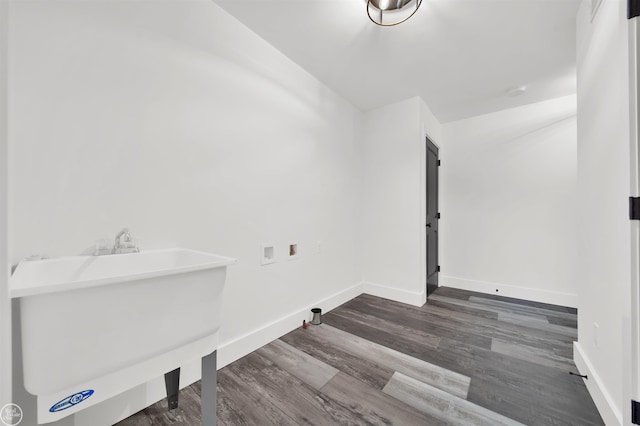 laundry area with washer hookup, dark hardwood / wood-style flooring, and sink