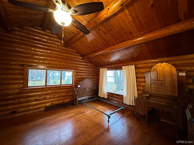 bedroom featuring vaulted ceiling with beams, hardwood / wood-style floors, rustic walls, and wood ceiling