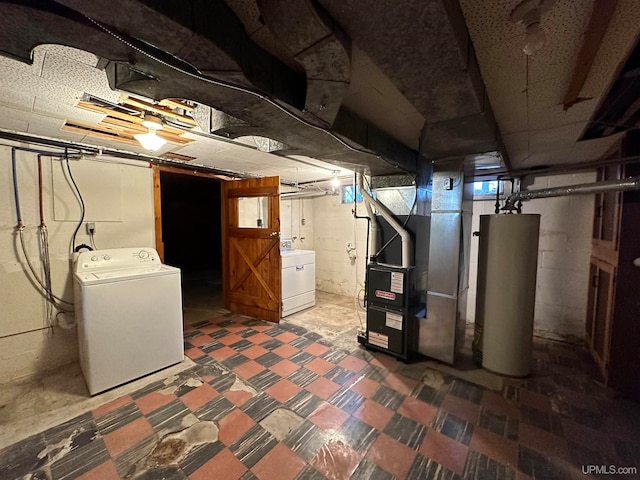 basement with water heater, heating utilities, carpet floors, and washer / clothes dryer