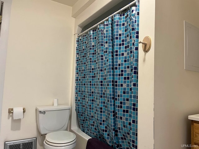 bathroom with toilet and vanity