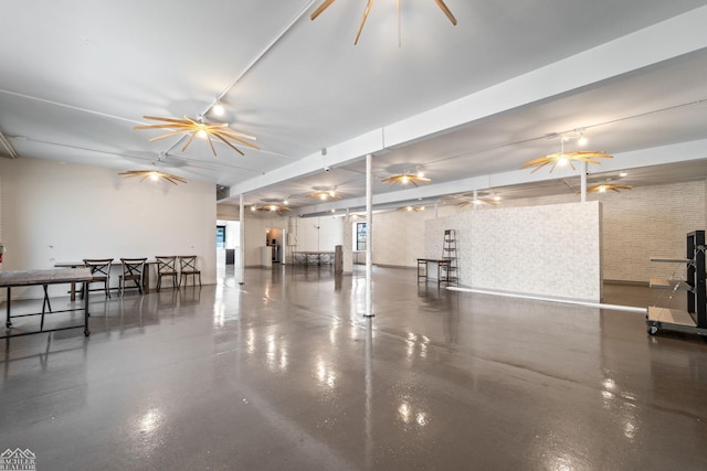 interior space with ceiling fan