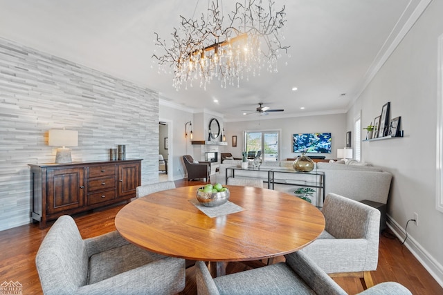 dining area with crown molding, ceiling fan, and hardwood / wood-style floors