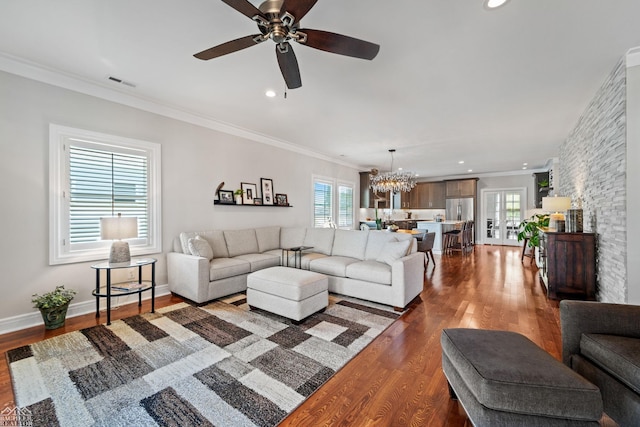 living room with ornamental molding and a wealth of natural light