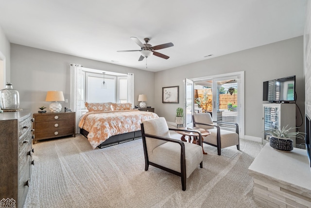 carpeted bedroom with access to outside and ceiling fan