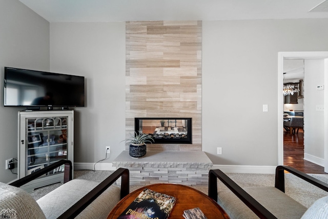 living room featuring a multi sided fireplace