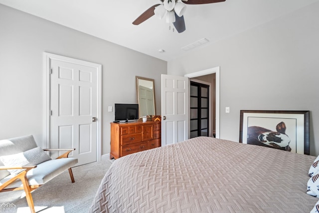 bedroom with ceiling fan and carpet flooring