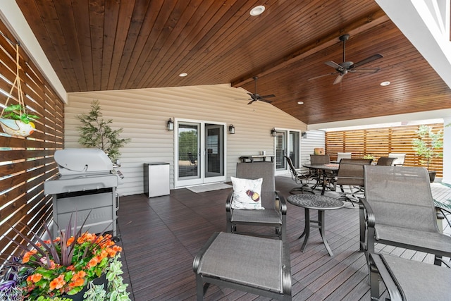 wooden terrace featuring grilling area and ceiling fan