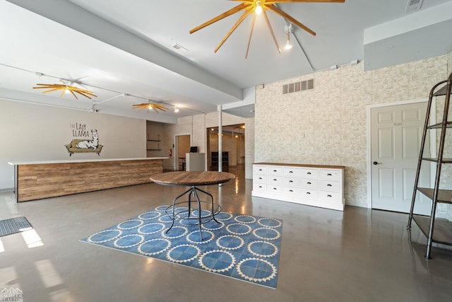 interior space with ceiling fan