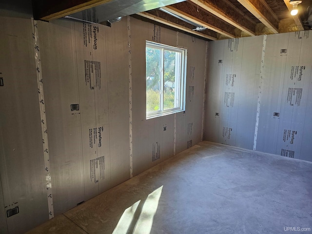 spare room featuring concrete flooring