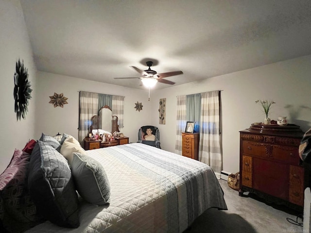 bedroom featuring baseboard heating, a ceiling fan, and light colored carpet