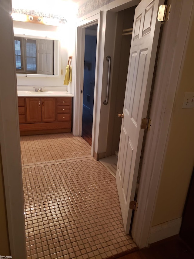 bathroom with vanity and tile patterned flooring