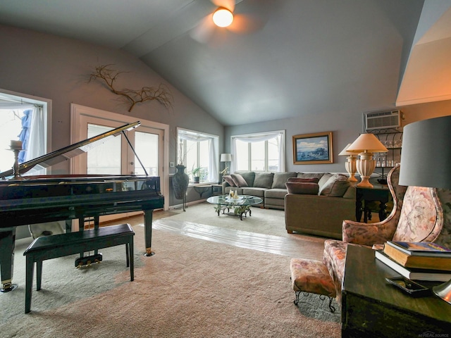 interior space with ceiling fan, lofted ceiling, and a wall mounted AC